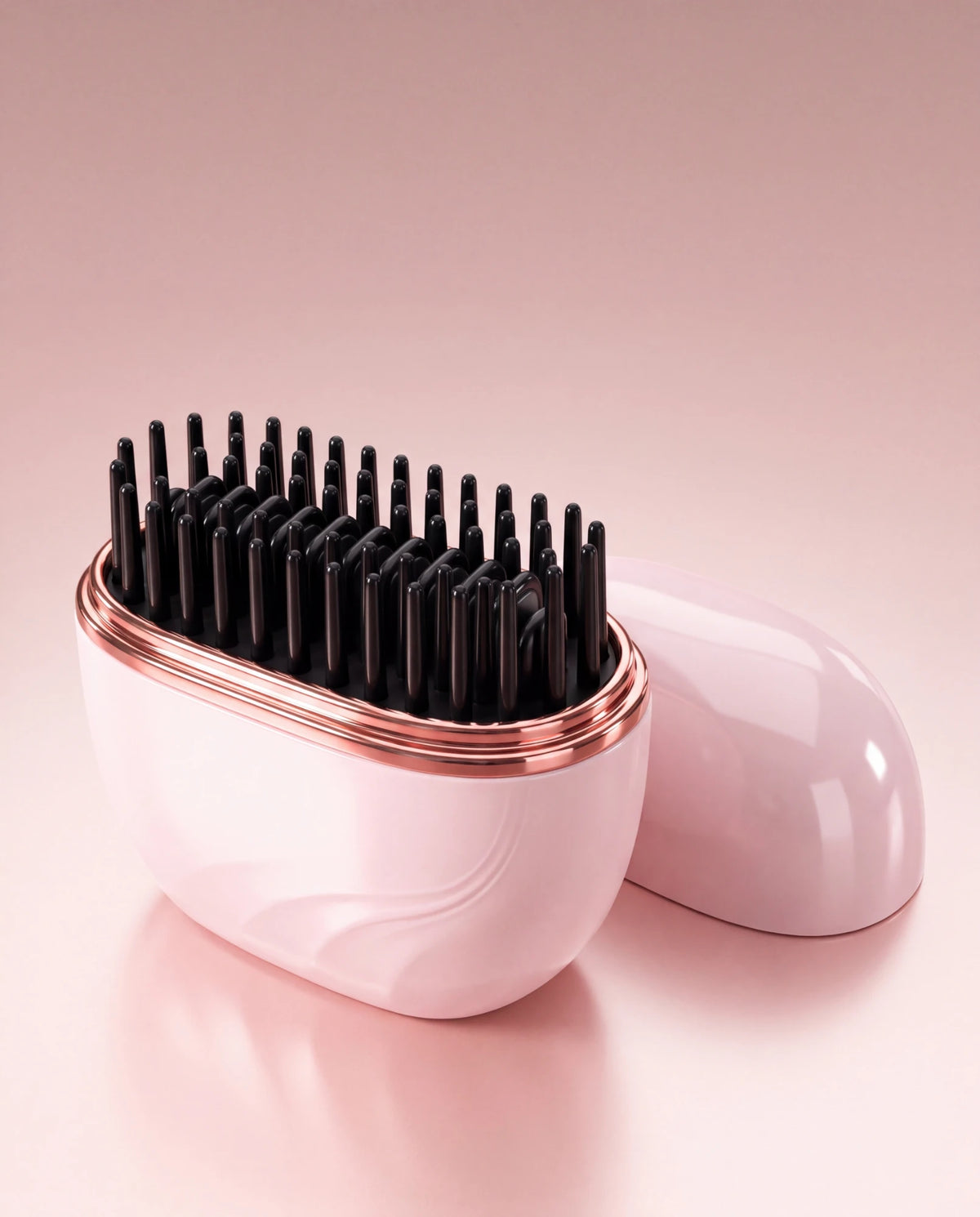 The Mini open with black comb pins and rose-gold rim, lid beside it