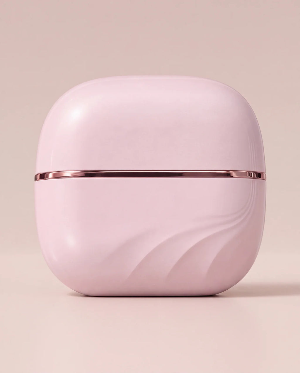 The Mini closed with its lid on, pink with a thin rose-gold line