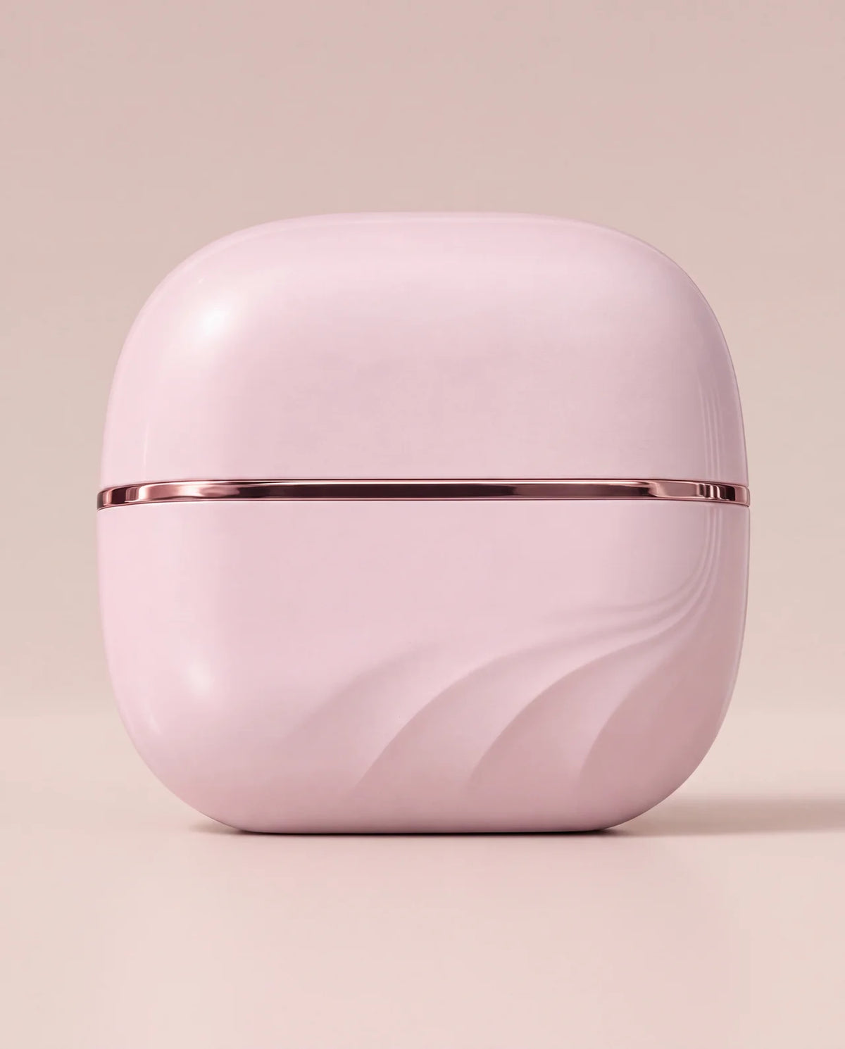 The Mini closed with its lid on, pink with a thin rose-gold line